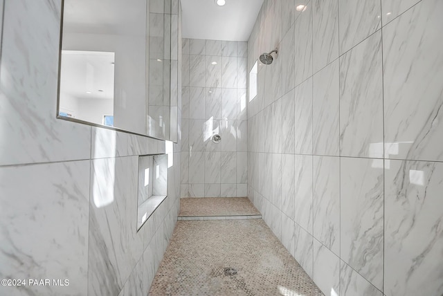 bathroom with a tile shower