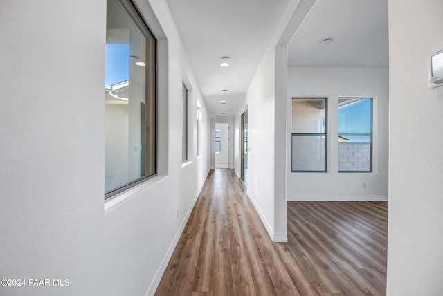 hall with light hardwood / wood-style flooring