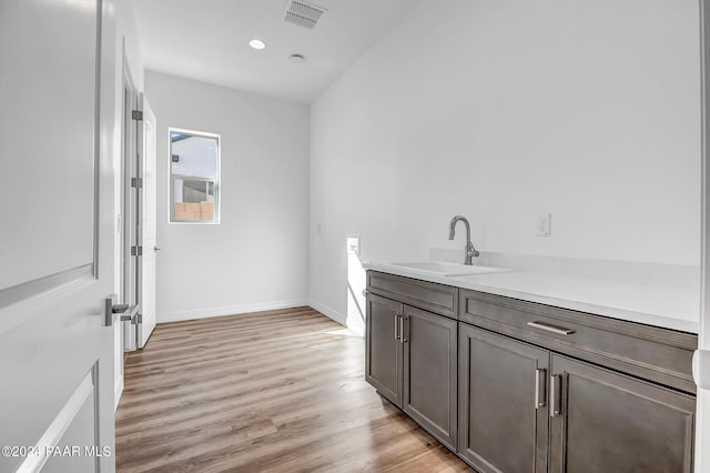 bathroom featuring hardwood / wood-style flooring and vanity