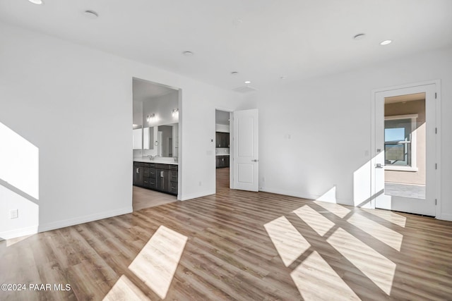 unfurnished living room with light hardwood / wood-style flooring