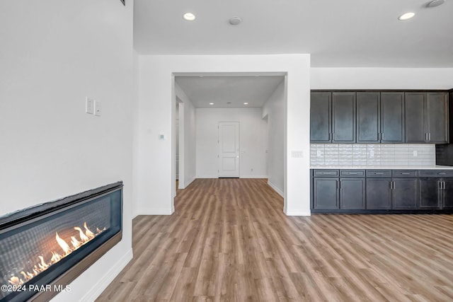 unfurnished living room with light wood-type flooring