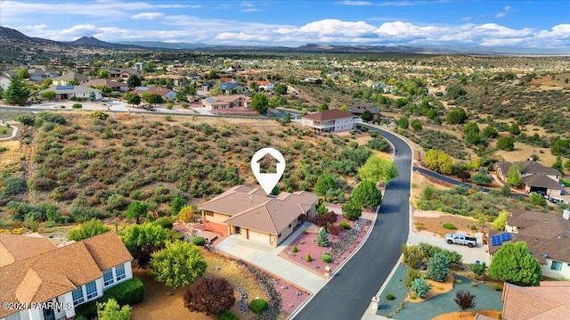 birds eye view of property with a mountain view