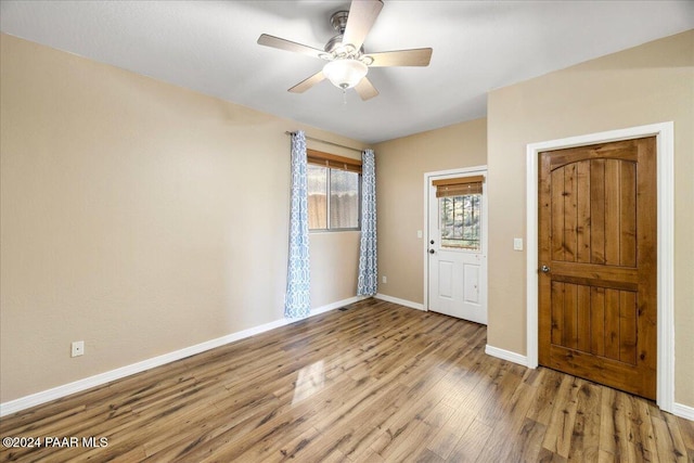 foyer with ceiling fan and light hardwood / wood-style flooring