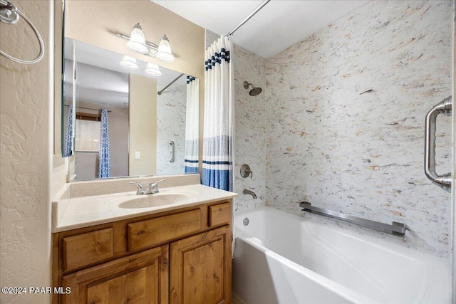 bathroom with shower / bath combination with curtain and vanity