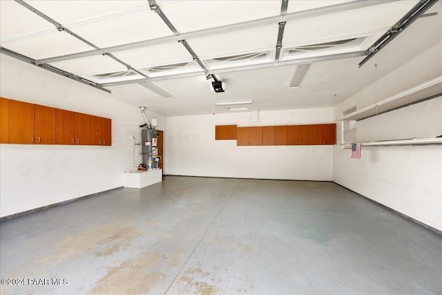 garage featuring a garage door opener and gas water heater