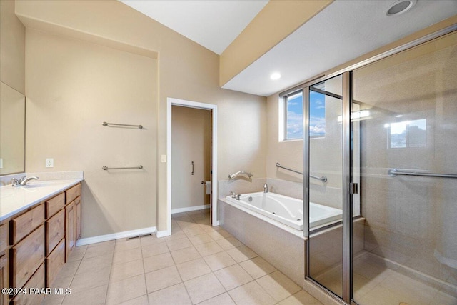 bathroom with vanity, tile patterned floors, and plus walk in shower