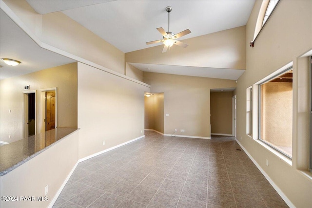 unfurnished room featuring high vaulted ceiling and ceiling fan