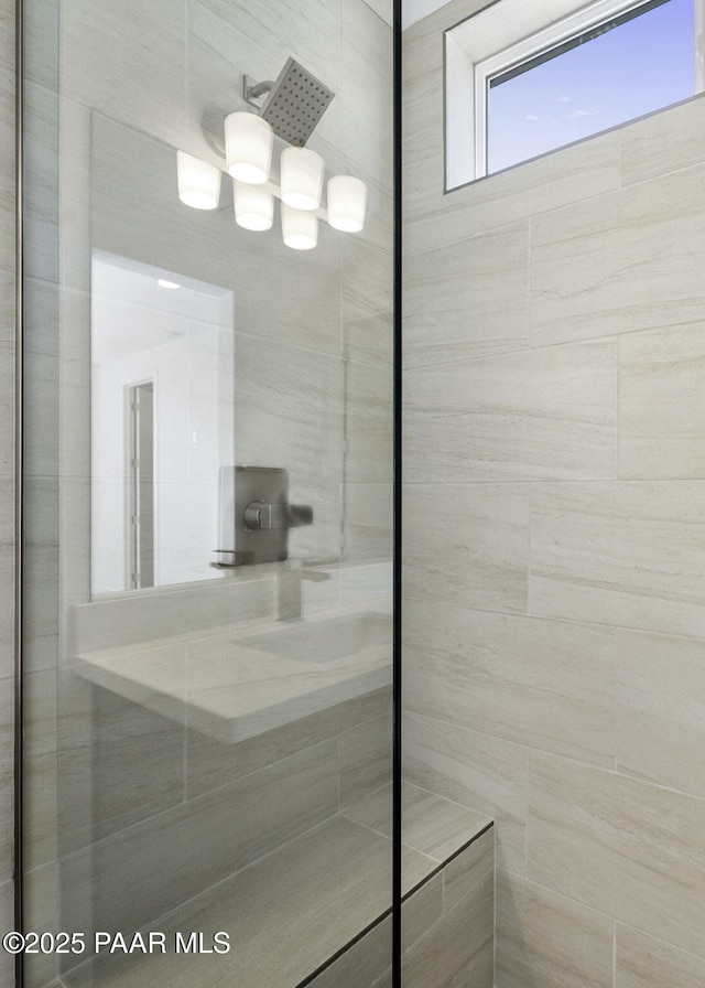 bathroom with tiled shower