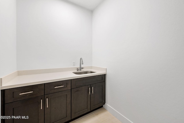 bathroom with tile patterned floors and sink