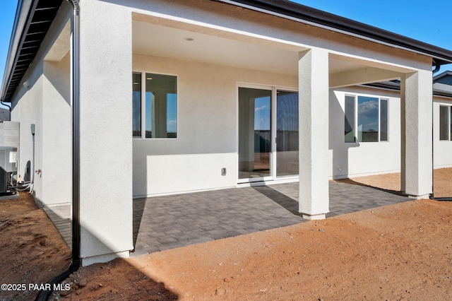 rear view of property featuring a patio area