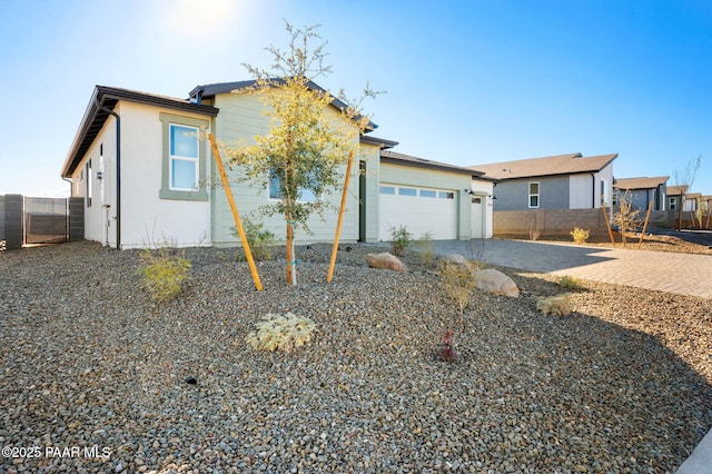 ranch-style home featuring a garage