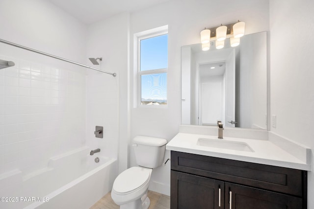 full bathroom featuring vanity, bathtub / shower combination, and toilet