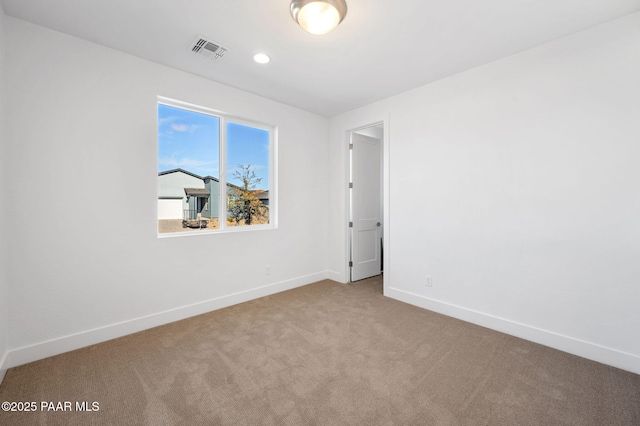 spare room featuring carpet flooring