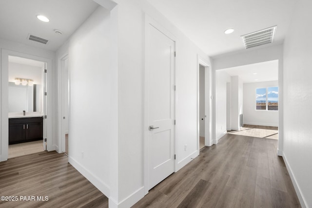 corridor featuring light hardwood / wood-style floors