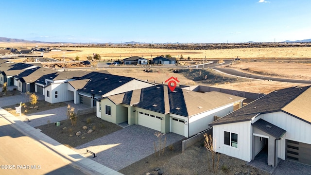 birds eye view of property featuring a mountain view