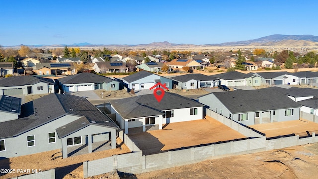 birds eye view of property with a mountain view