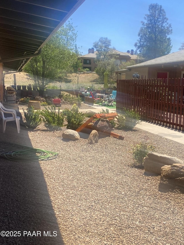 view of yard featuring fence and a patio area