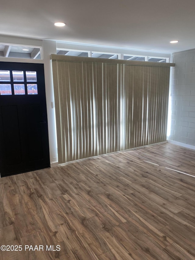 entryway with recessed lighting and wood finished floors