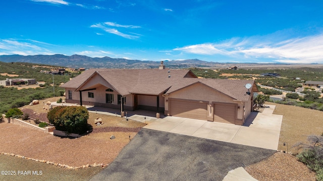 single story home with a mountain view