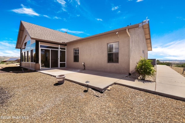 back of property featuring a patio area