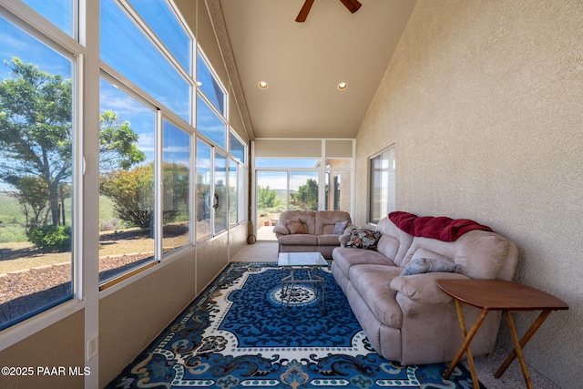 sunroom / solarium with ceiling fan and vaulted ceiling