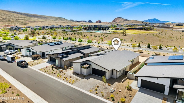 aerial view featuring a mountain view and a residential view