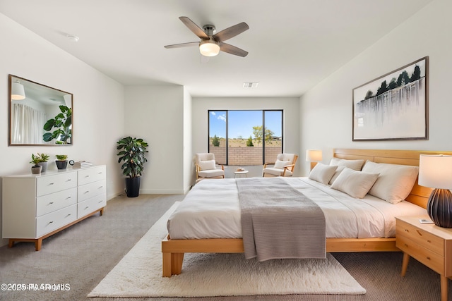 bedroom with ceiling fan, visible vents, light carpet, and baseboards