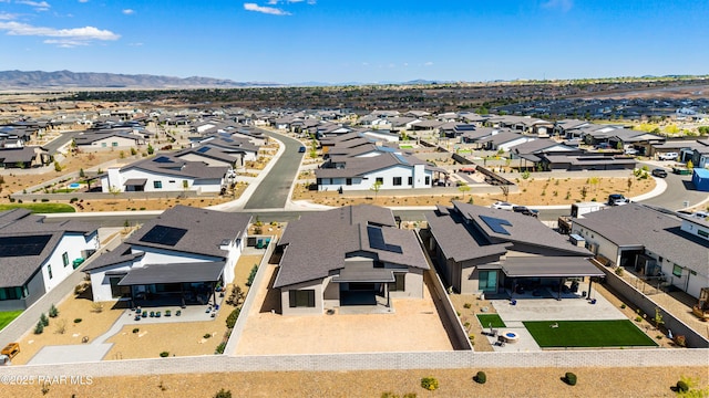 drone / aerial view with a residential view and a mountain view