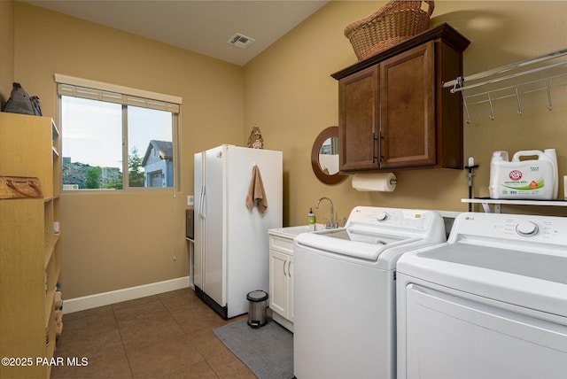 5245 Wellness Way, Prescott, AZ 86301 - clothes washing area featuring washer and clothes dryer, cabinet space, tile patterned floors, and baseboards