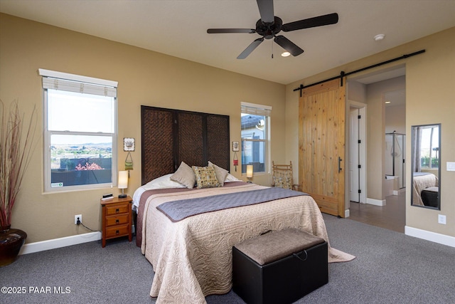 5245 Wellness Way, Prescott, AZ 86301 - bedroom with a barn door, carpet floors, baseboards, and a ceiling fan