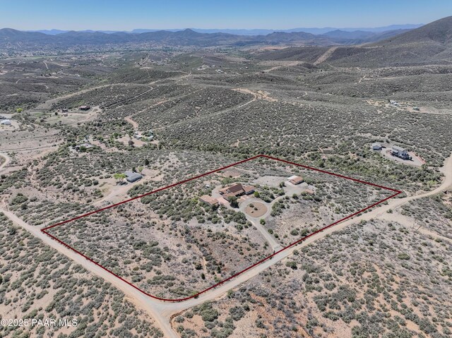 10412 E Prescott Dells Ranch Rd, Dewey-Humboldt, AZ 86327 - aerial overview of property's location with property boundaries highlighted and a mountain backdrop