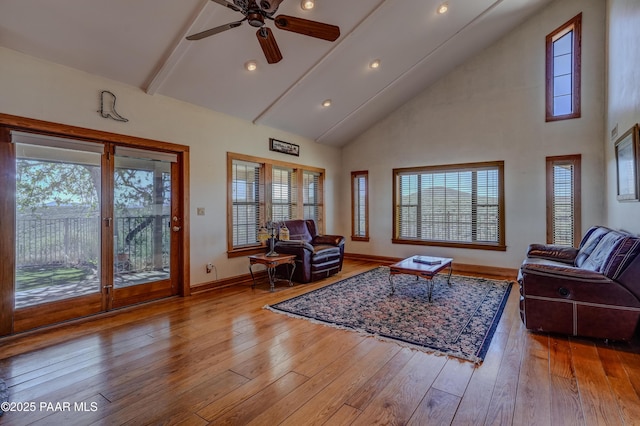 10412 E Prescott Dells Ranch Rd, Dewey-Humboldt, AZ 86327 - living area featuring high vaulted ceiling, beam ceiling, hardwood / wood-style floors, and a ceiling fan