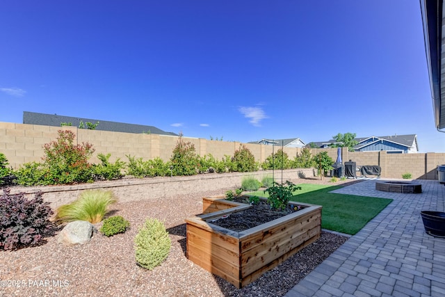 7028 Corral Ct, Prescott, AZ 86305 - fenced backyard featuring a patio area and a garden