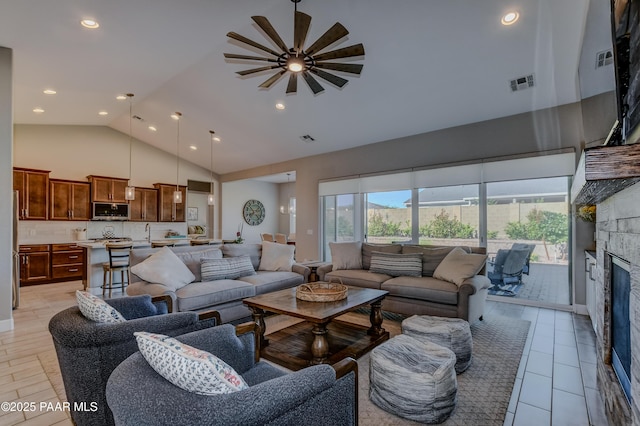7028 Corral Ct, Prescott, AZ 86305 - living room featuring high vaulted ceiling, ceiling fan, a fireplace, and recessed lighting