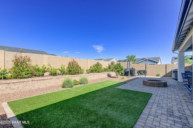 7028 Corral Ct, Prescott, AZ 86305 - fenced backyard featuring an outdoor fire pit and a patio