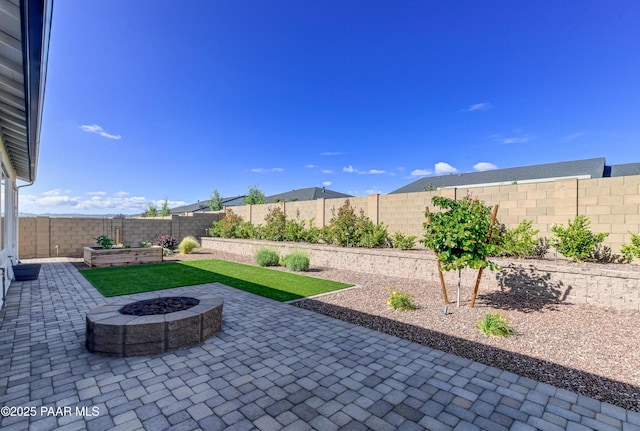 7028 Corral Ct, Prescott, AZ 86305 - fenced backyard with a patio area and a fire pit