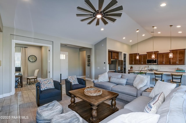 7028 Corral Ct, Prescott, AZ 86305 - living area featuring a ceiling fan, vaulted ceiling, light wood finished floors, and recessed lighting