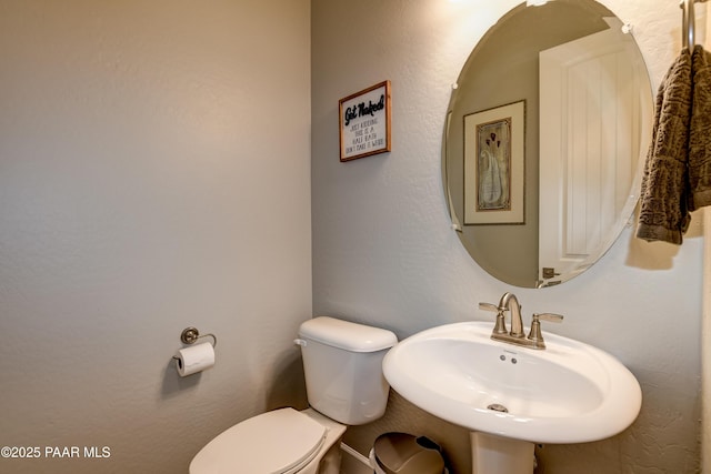 7028 Corral Ct, Prescott, AZ 86305 - half bathroom featuring toilet and a sink