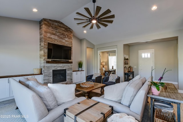 7028 Corral Ct, Prescott, AZ 86305 - living area featuring vaulted ceiling, ceiling fan, a fireplace, and recessed lighting