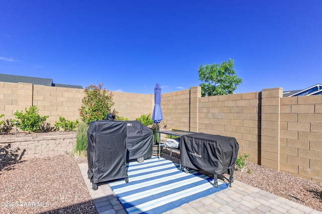 7028 Corral Ct, Prescott, AZ 86305 - fenced backyard with a patio area and area for grilling
