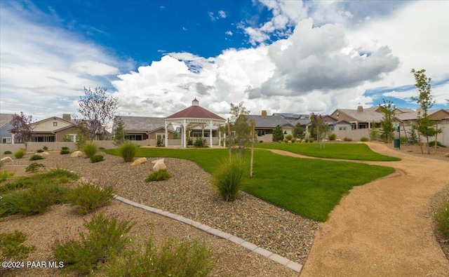 exterior space featuring a gazebo and a yard