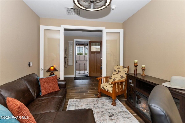 living room with dark hardwood / wood-style floors