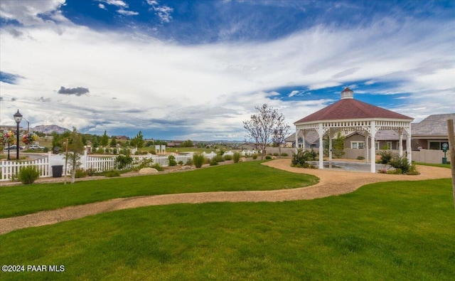 view of property's community featuring a gazebo and a lawn