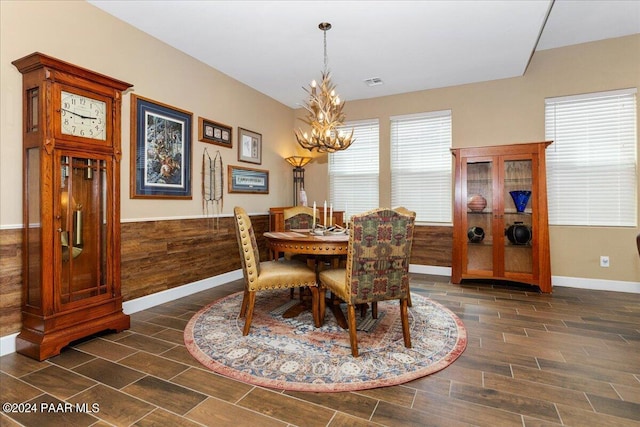 dining area featuring a notable chandelier