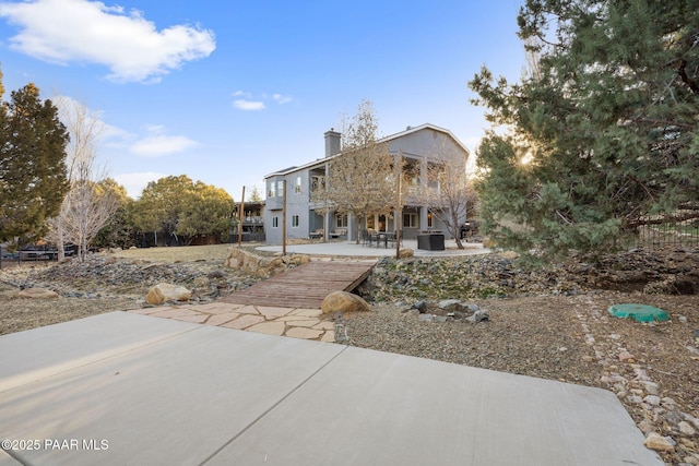 back of property featuring a patio