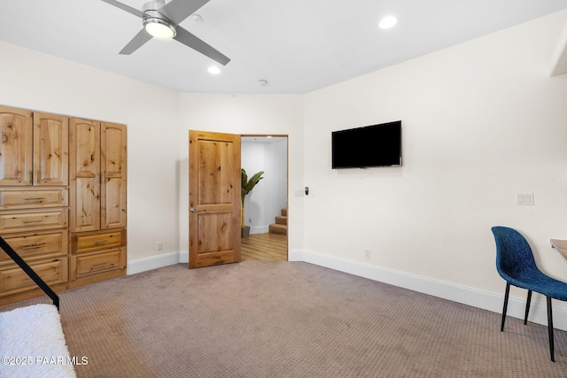 carpeted bedroom featuring ceiling fan