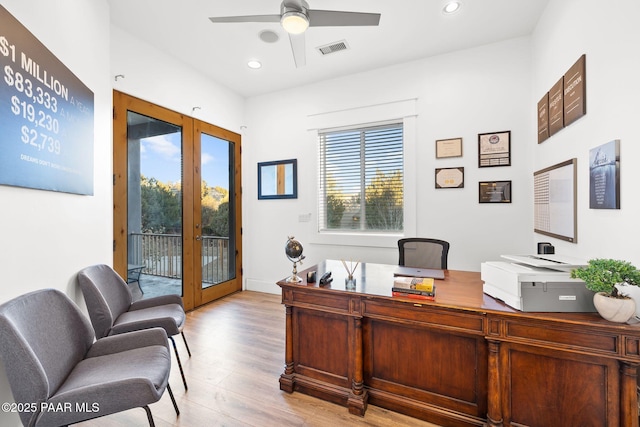 office featuring ceiling fan, light wood-type flooring, and french doors