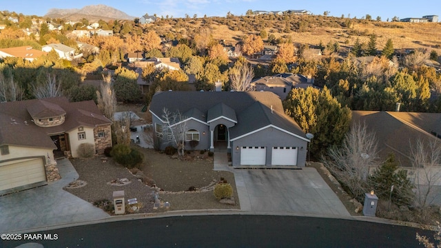 birds eye view of property featuring a mountain view