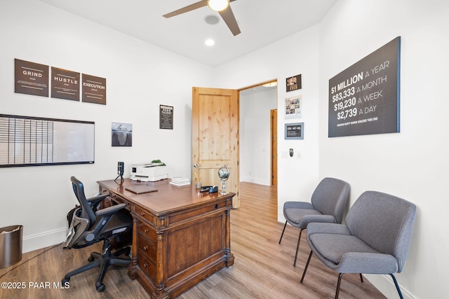 office with hardwood / wood-style flooring and ceiling fan