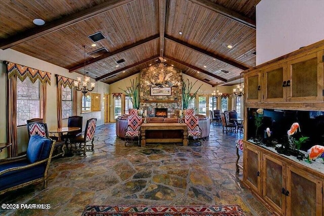 living room featuring wooden ceiling, beam ceiling, stone tile flooring, and an inviting chandelier
